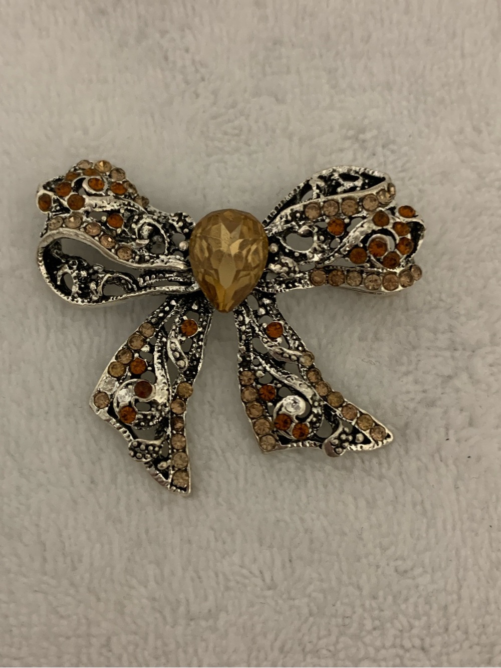 Bow-Shaped Amber Crystal Brooch